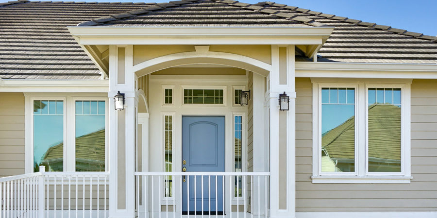 House entrance with blue door and porch.