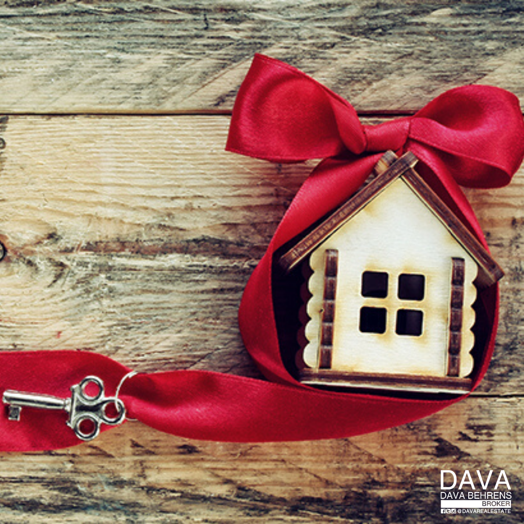 Housewarming gift: keys and red ribbon.