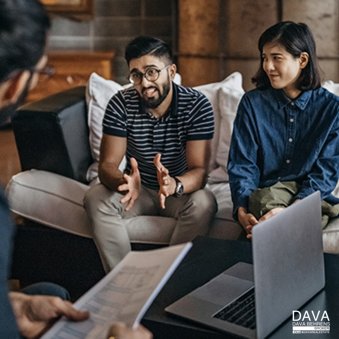 Couple discussing finances with advisor.