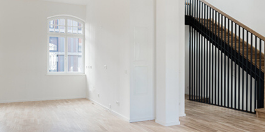 Empty modern home interior with stairs.