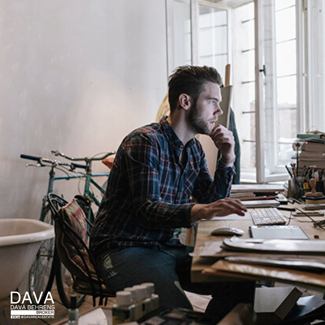 Man working on computer at home.