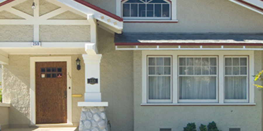 Craftsman style house with garden.