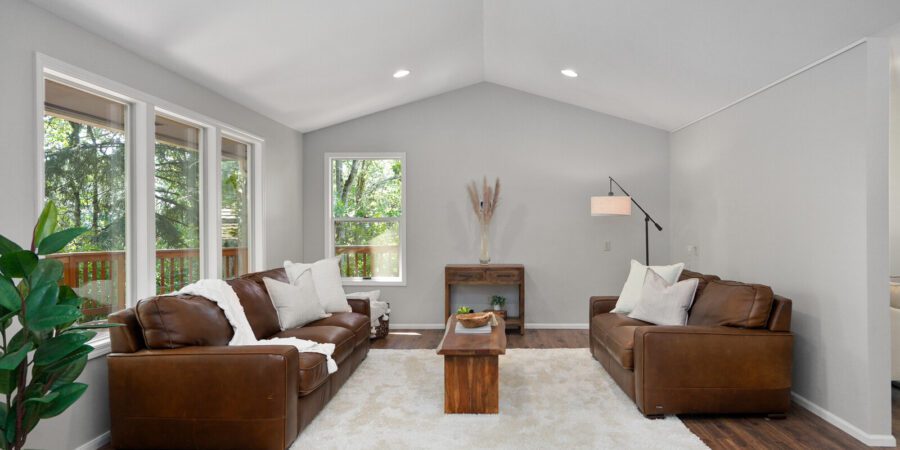 Spacious living room with leather sofas.
