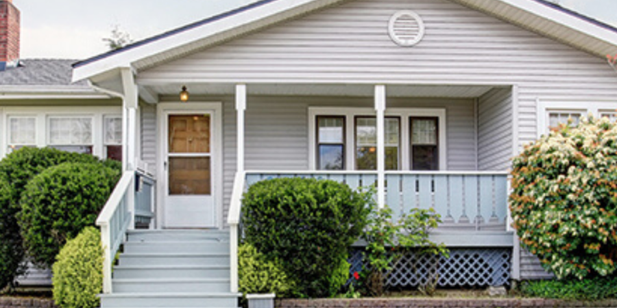 Gray house with porch and steps.