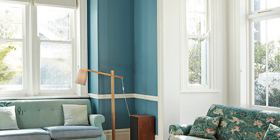 Blue living room with two sofas.