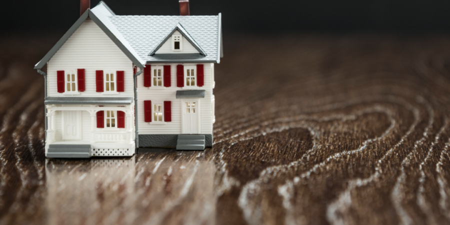 Model house on wooden surface.