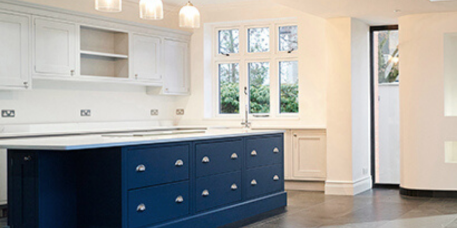 Modern kitchen with blue island.