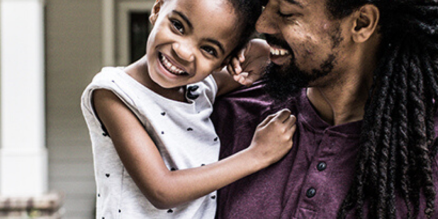 Happy father and daughter at home.