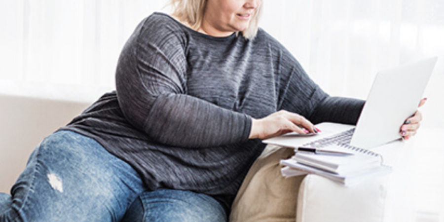 Woman working on laptop at home.