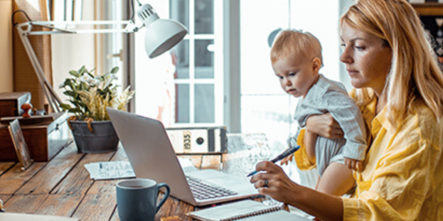 Woman works from home with baby.