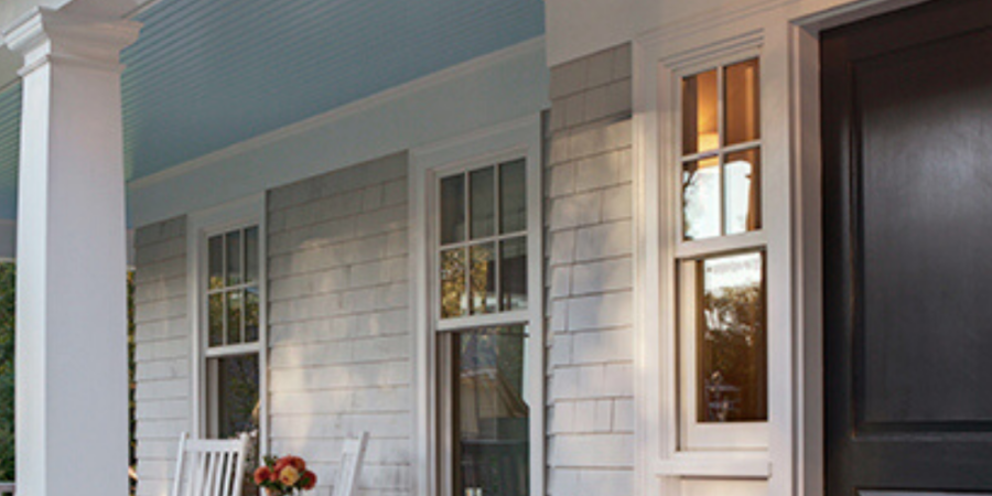 White house porch with rocking chairs.