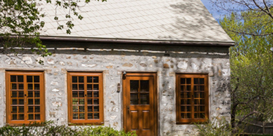 Stone cottage with spring tulips.