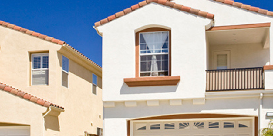 Two-story house with attached garage.