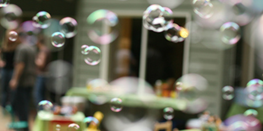 Bubbles float at an outdoor party.