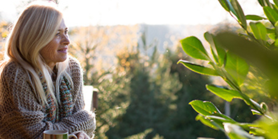 Woman enjoying a peaceful autumn view.