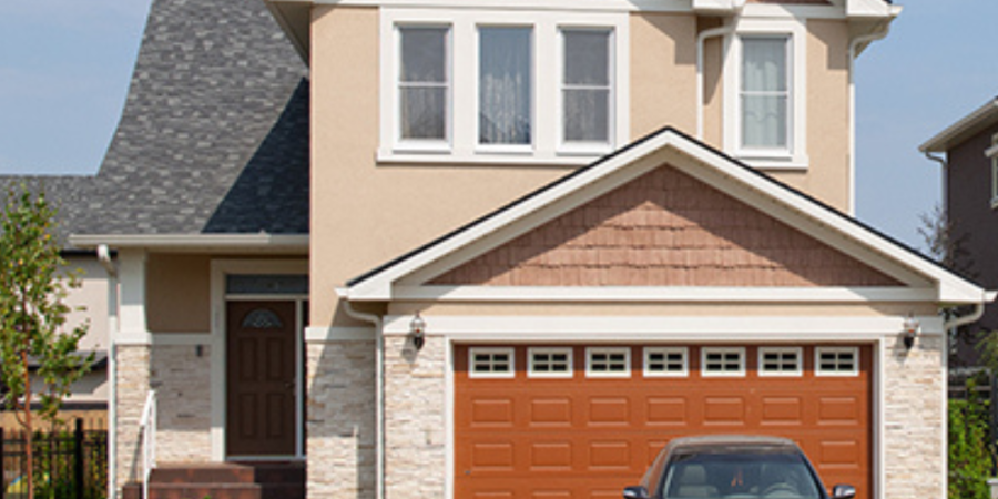 Two-story house with attached garage.