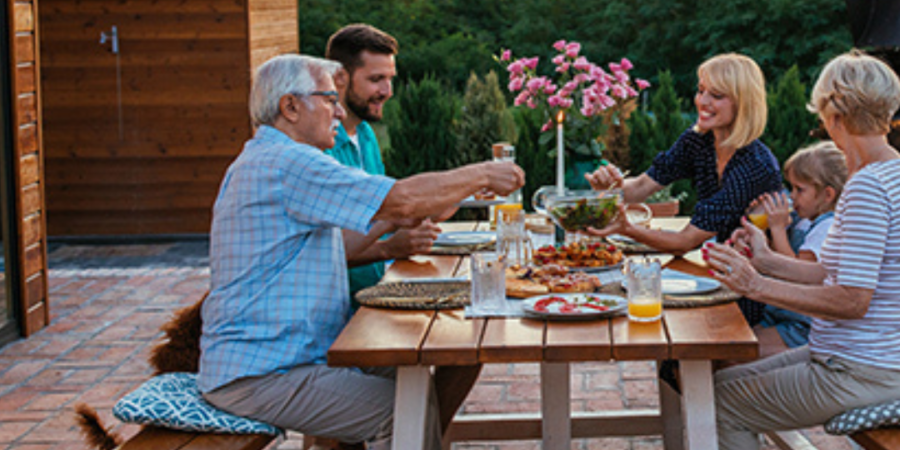 Family enjoying an outdoor dinner.