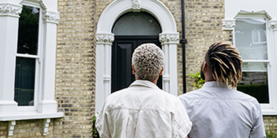 Couple viewing house, potential home buyers.