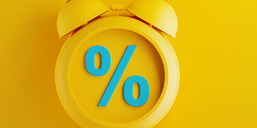 Yellow alarm clock showing percentage sign.