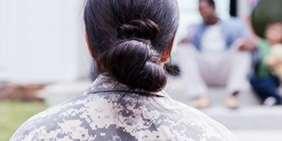 Soldier looking at family reunion.