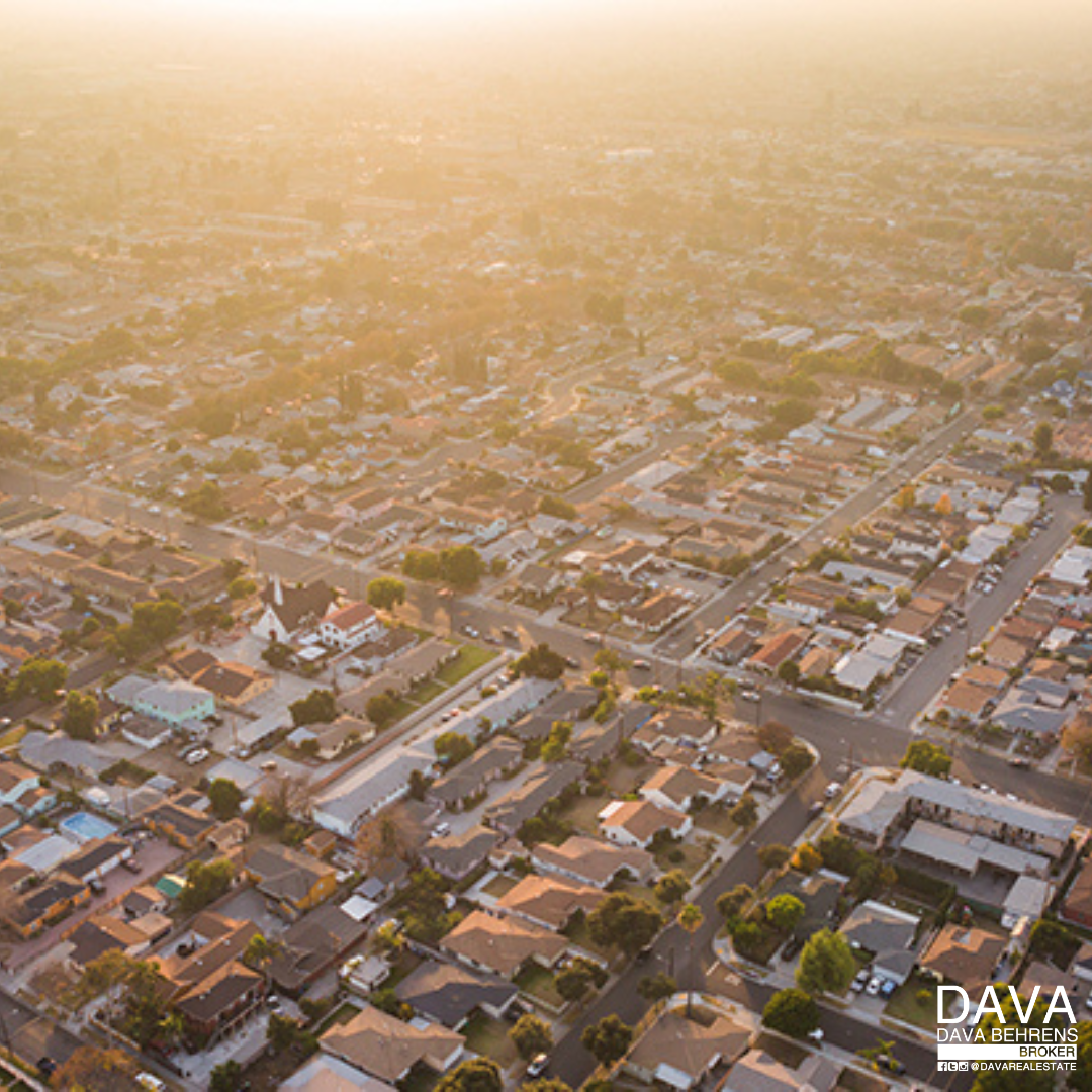 Aerial view of suburban neighborhood at sunset.