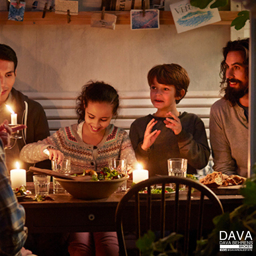 Family enjoying a candlelit dinner.