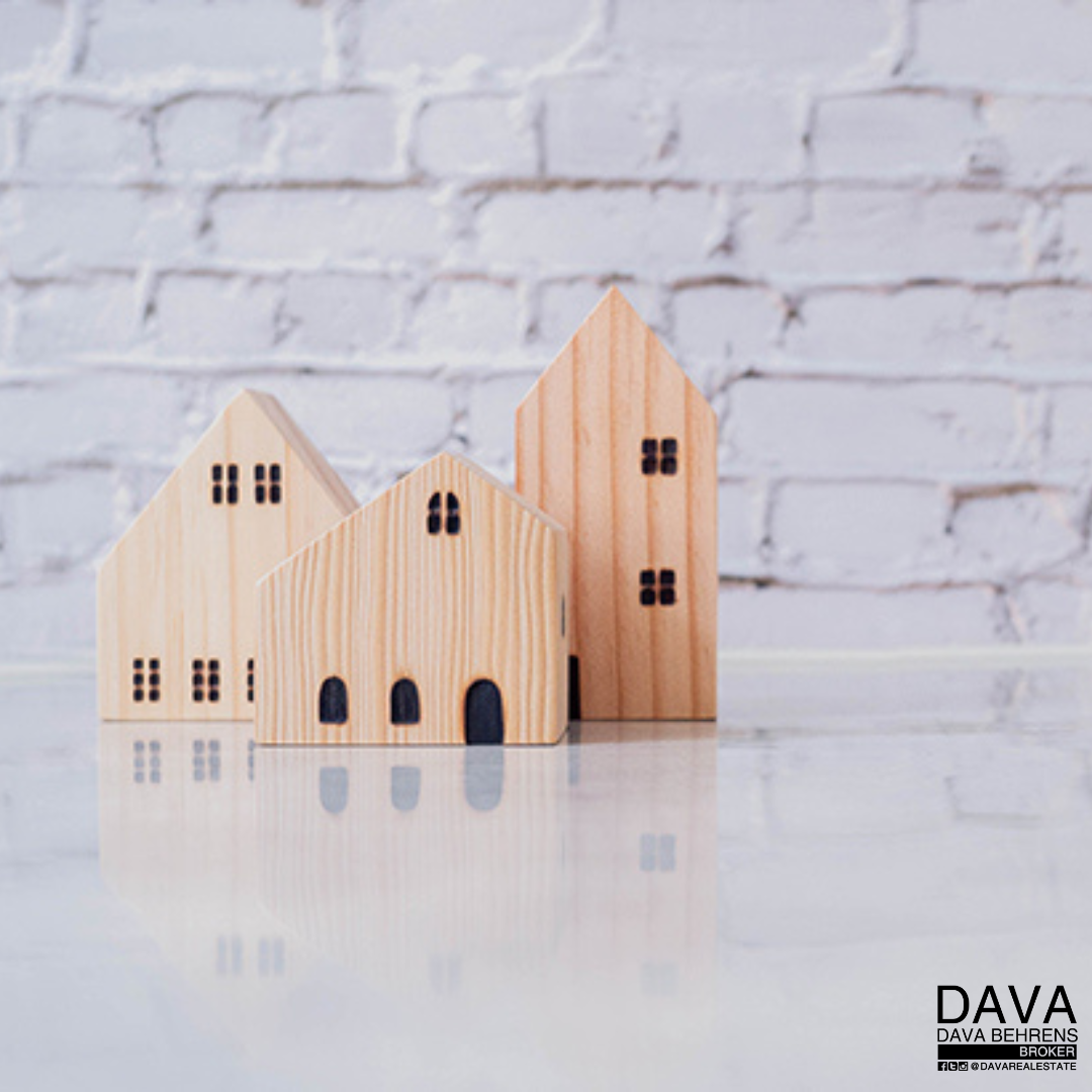 Wooden house models on white background.