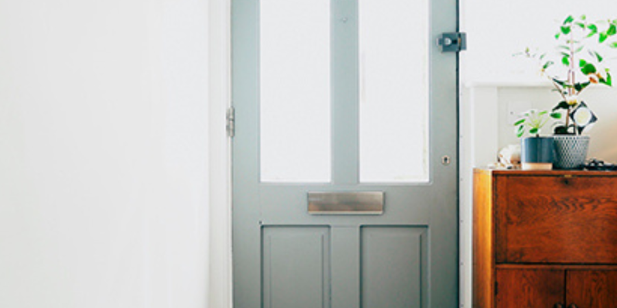 Gray front door with glass panels.