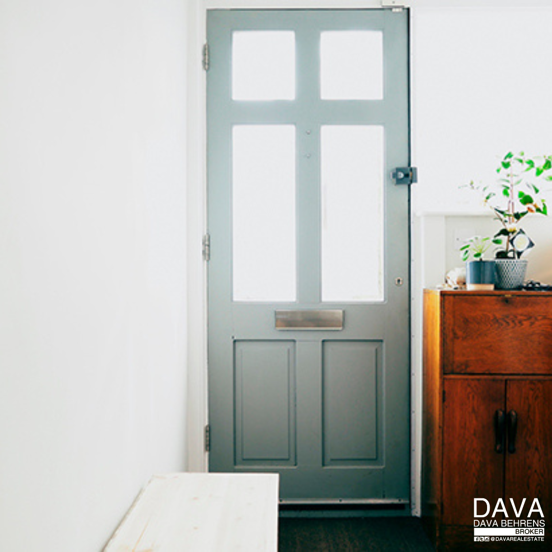 Gray front door with glass panels.