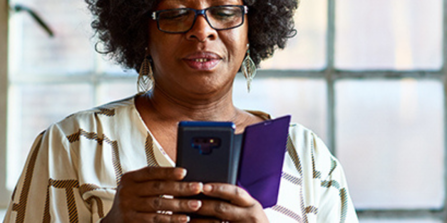 Woman using smartphone, checking messages.