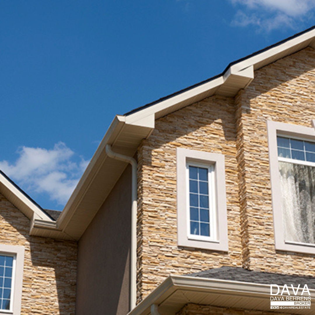 Stone house with new gutters and downspout.