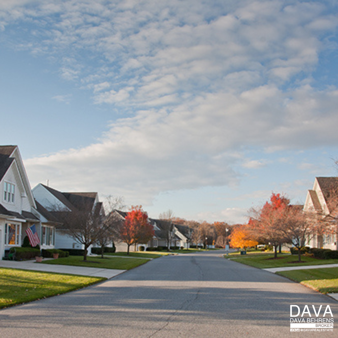 Suburban street lined with autumn homes.