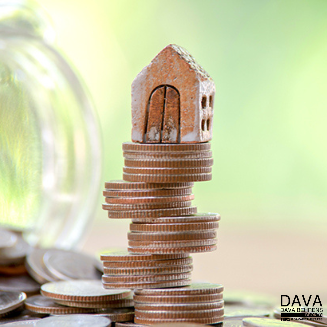 House model on a stack of coins.