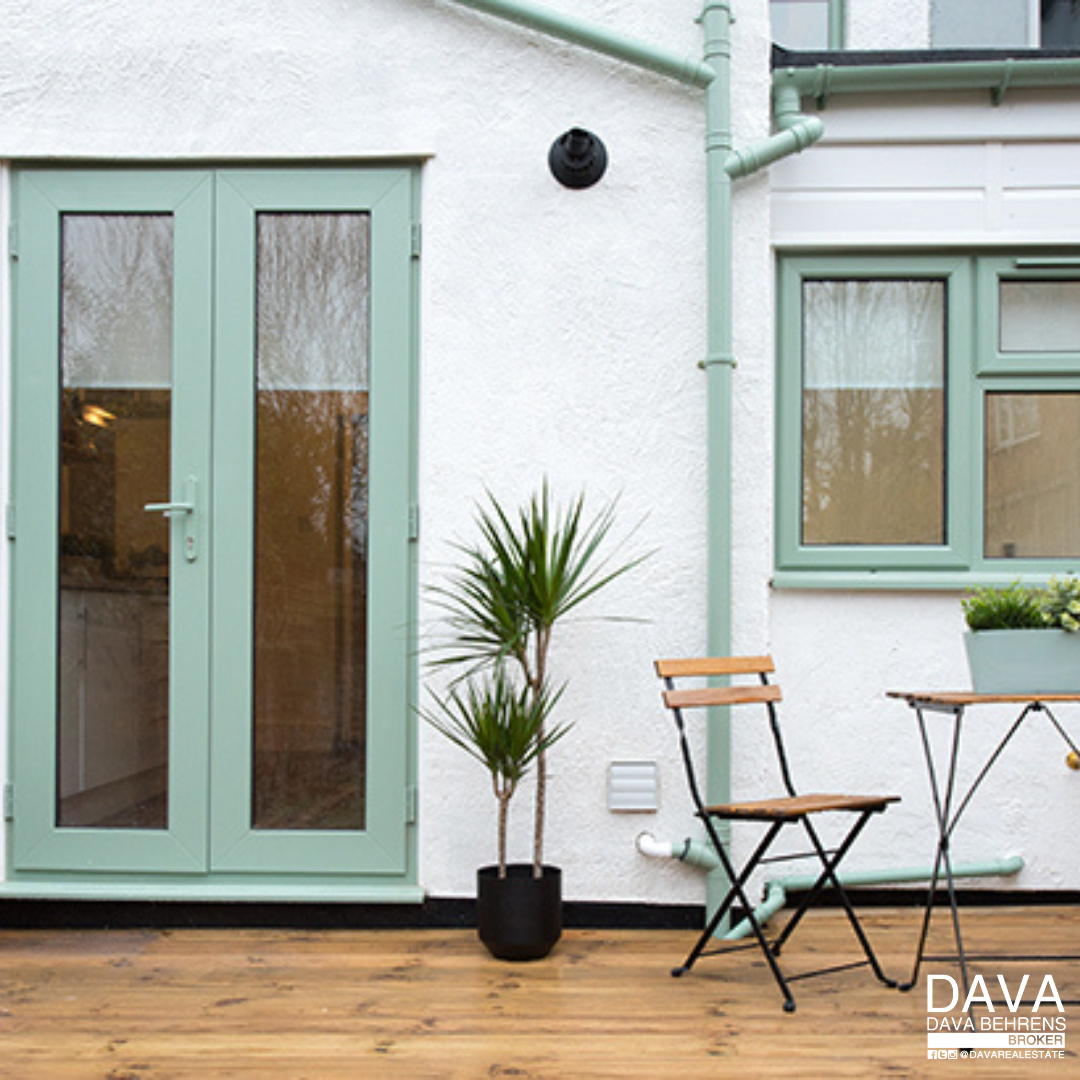 Pastel green French doors and patio.