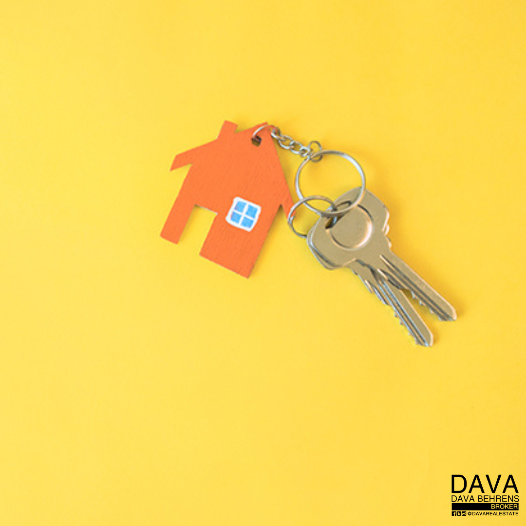 House-shaped keychain with keys.