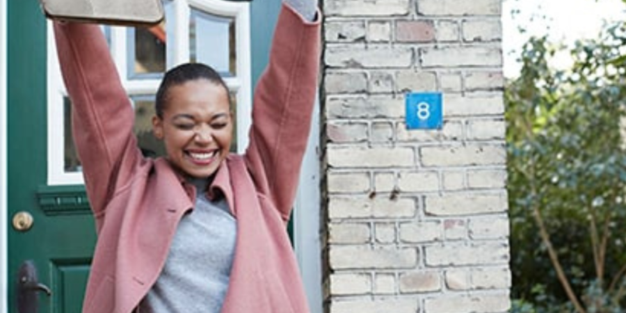 Woman celebrating new home keys.