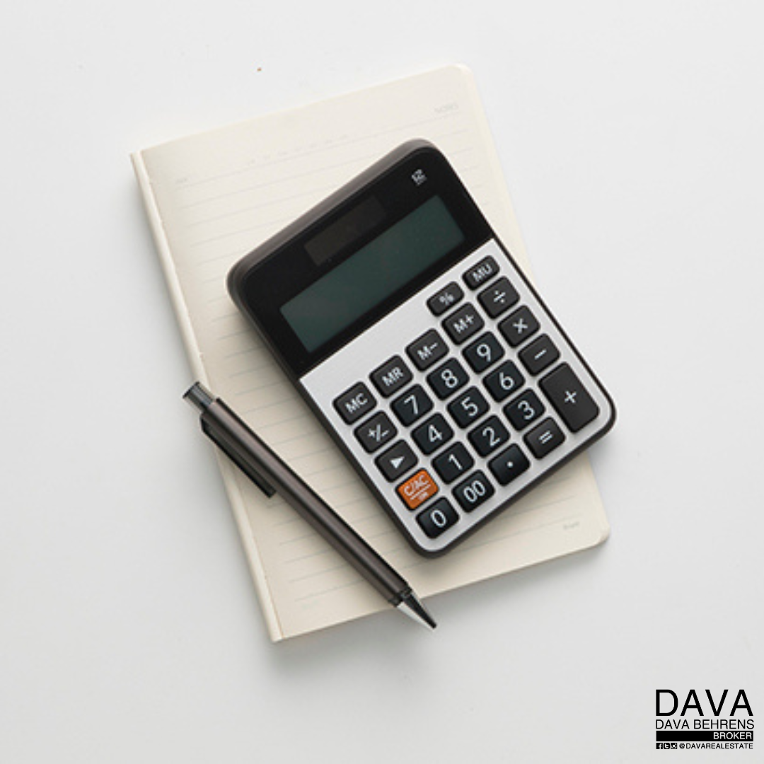 Calculator, notepad, and pen for calculations.