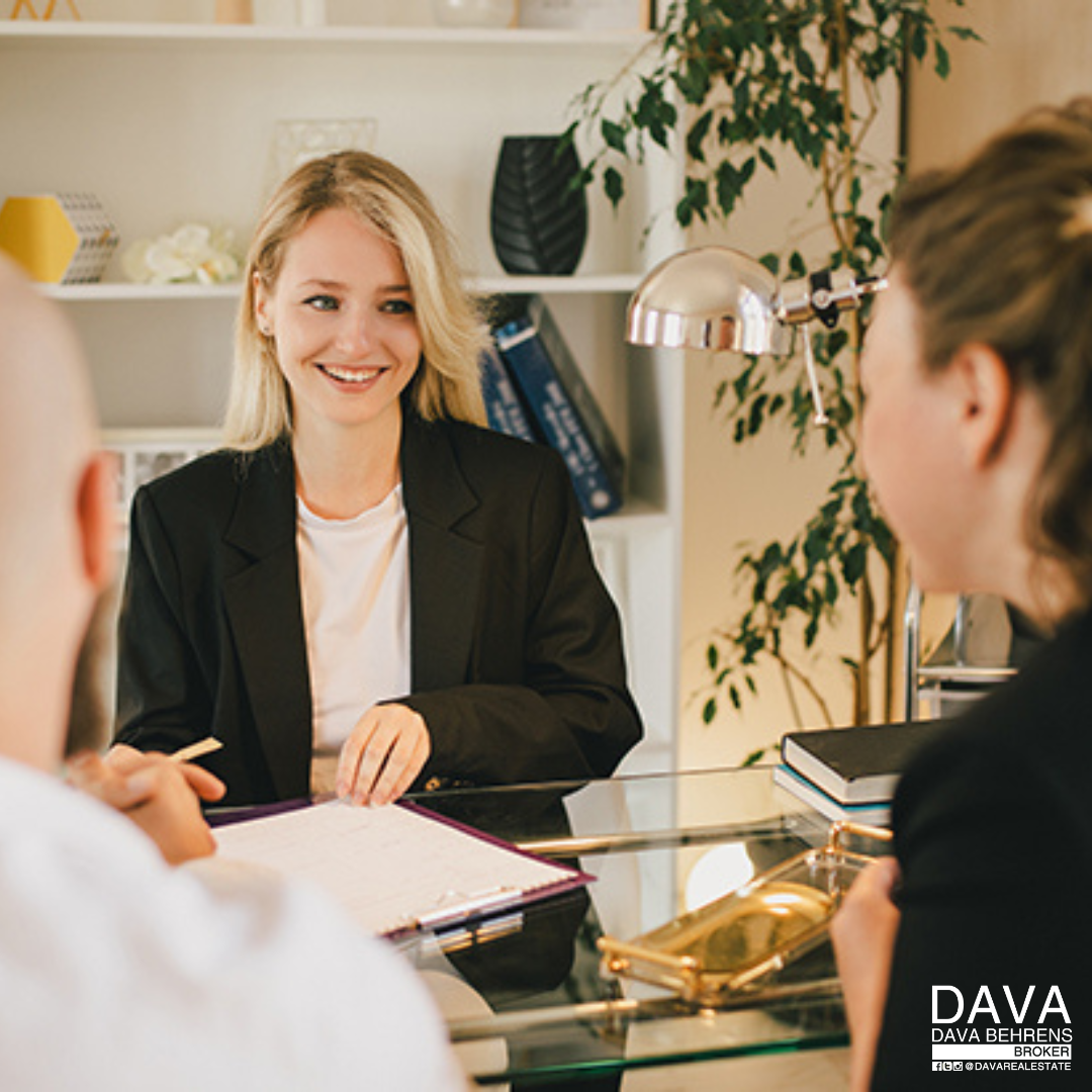 Businesswoman in a meeting, signing papers.