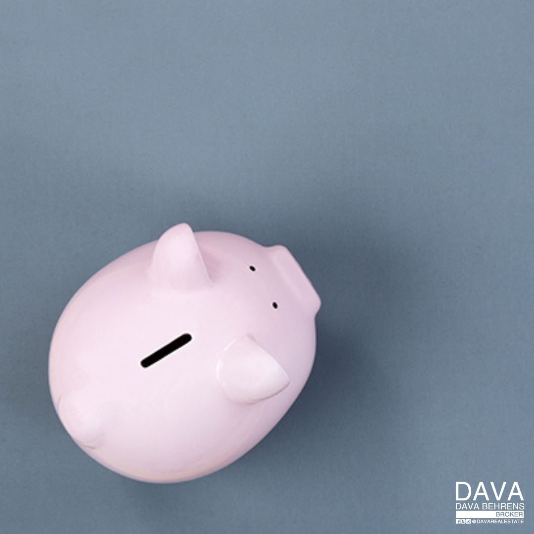 Pink piggy bank on blue background.