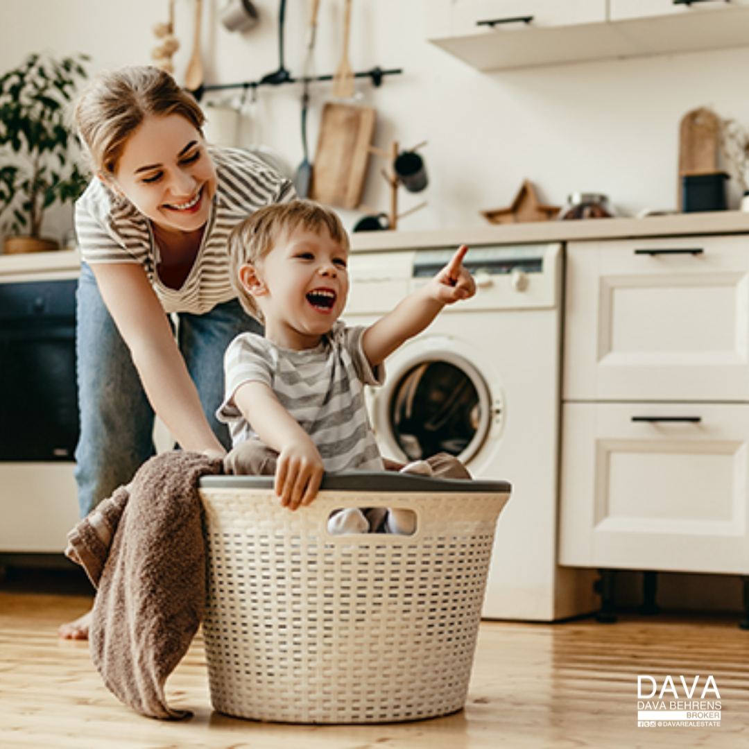 Mom and toddler in laundry basket.