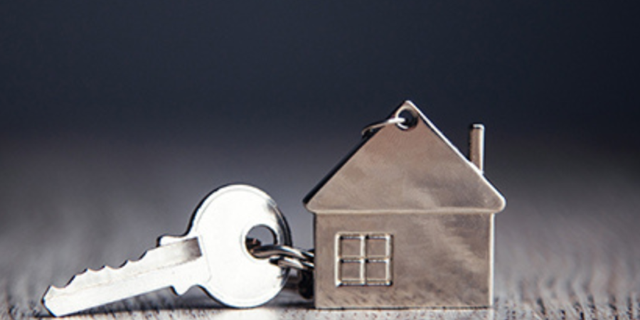 House key on wood table.