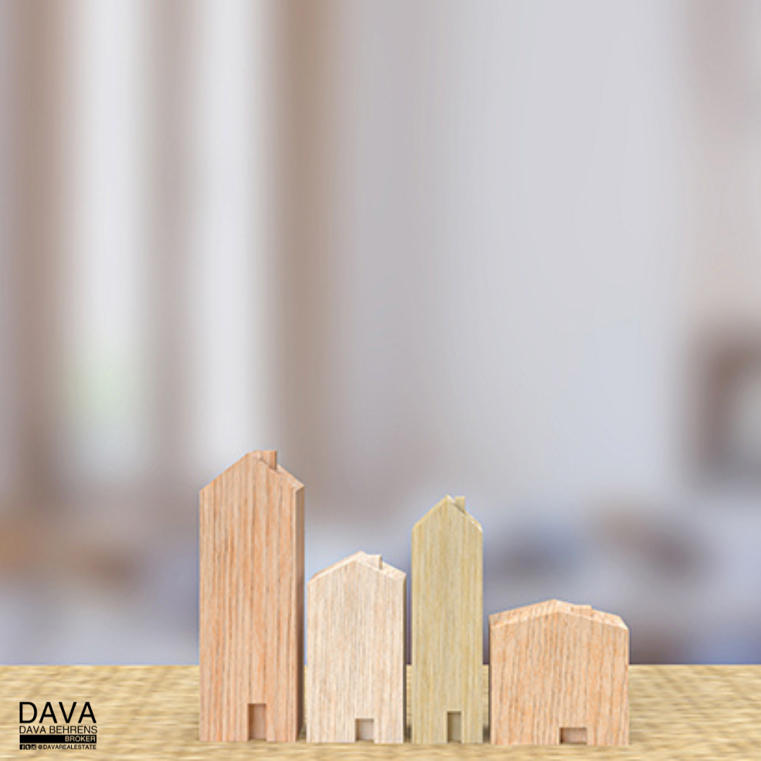 Wooden house models increasing in size.