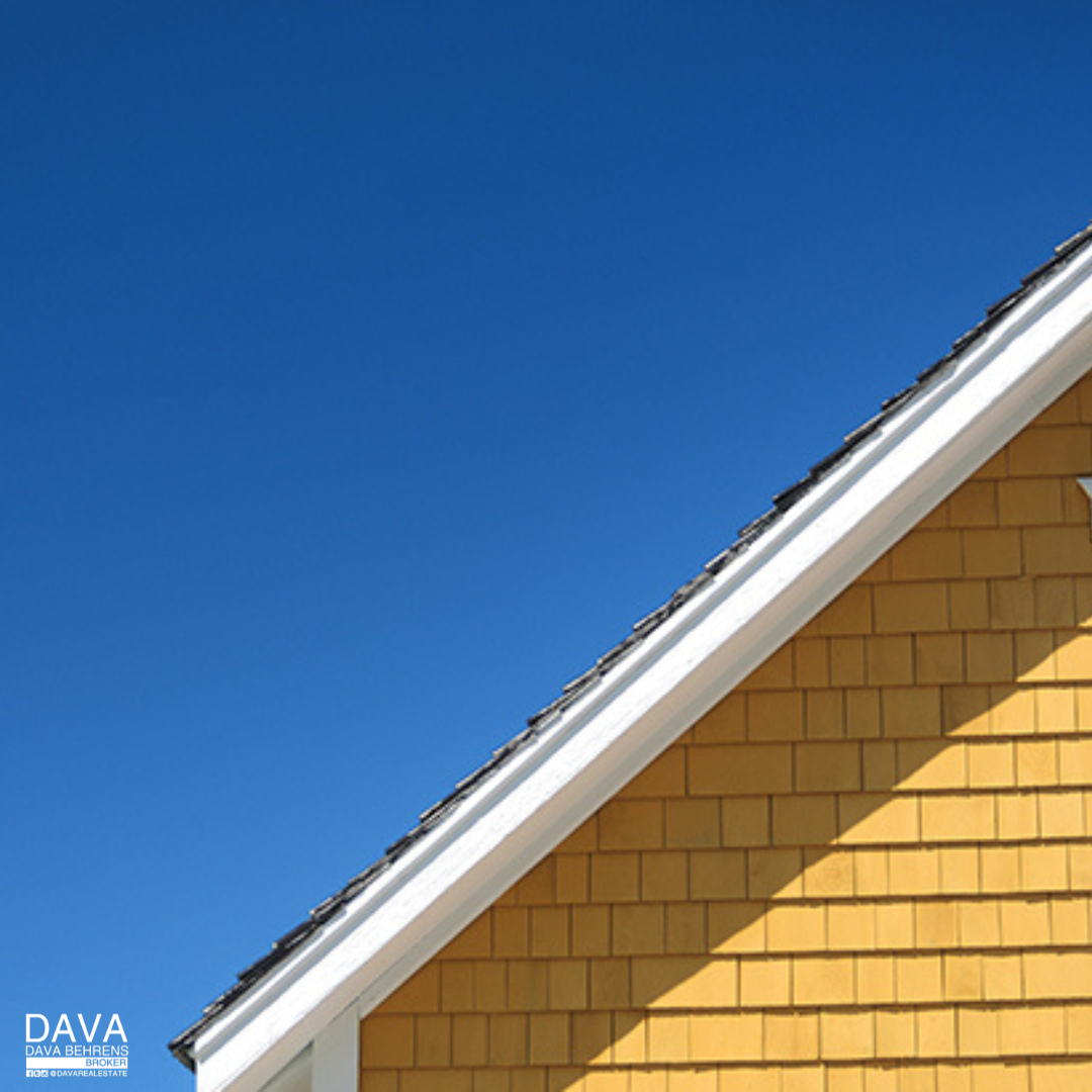 Yellow house corner, blue sky.