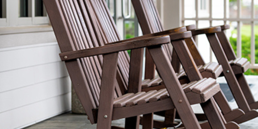 Brown rocking chairs on porch.