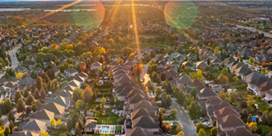 Sunset aerial view of suburban homes.