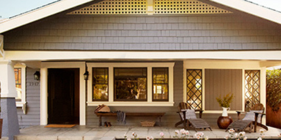 Gray Craftsman bungalow with porch.