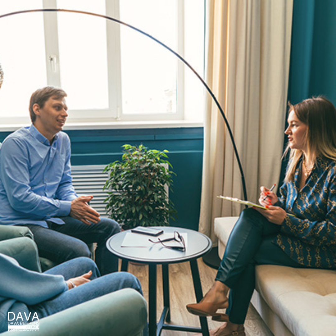 Couple in therapy session with counselor.