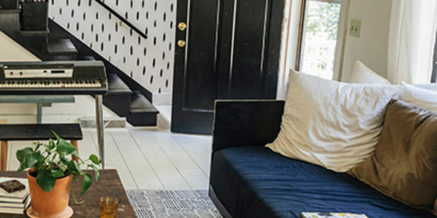 Modern living room with black door.