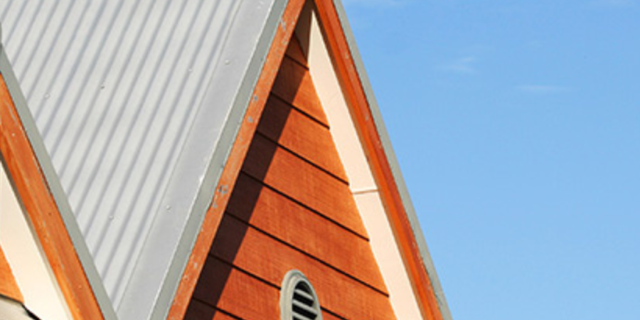 House gable, metal roof, wood siding.