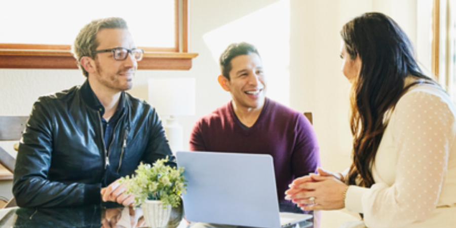 Couple meeting with real estate agent.